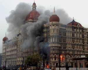 Mumbai: **FILE** Smoke is seen billowing out of the ground and first floor of the Taj Hotel in south Mumbai during security personnel's "Operation Cyclone" following the 26/11 terror attacks in 2008. Pakistani gunman Ajmal Amir Kasab, the sole surviving Pakistani gunman involved in the Mumbai attacks, was hanged to death at the Yerawada central prison in Pune on Wednesday morning. PTI Photo (PTI11_21_2012_000014B)