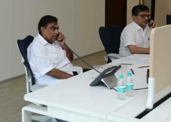 mukesh ambani in his office with his partner