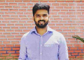 IAS Arjun Gowda smiling