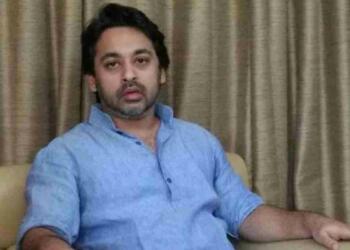 Nilesh Narayan Rane sitting on couch