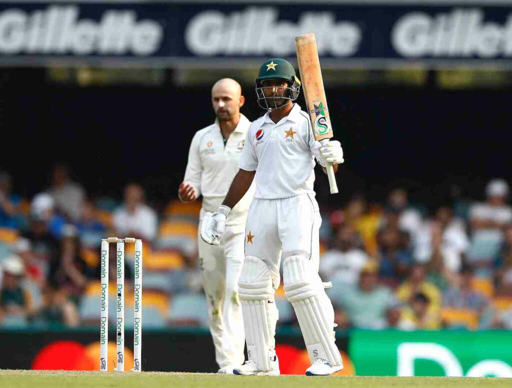 Asad Shafiq celebrating his 100