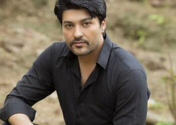 Anas Rashid in black shirt
