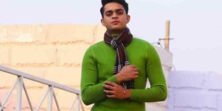 namit shah in green sweater