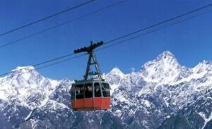 The charming Dharamshala ropeway in winter, set against the backdrop of the divine Himalayan ranges.