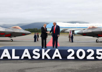 U.S. President Donald Trump goes to shake hands with Russian President Vladimir Putin, as they meet to negotiate for an end to the war in Ukraine, at Joint Base Elmendorf-Richardson in Anchorage, Alaska