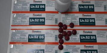 Himalaya Liv.52 DS tablets with original blister packs, bottle, and tablets for liver health support.