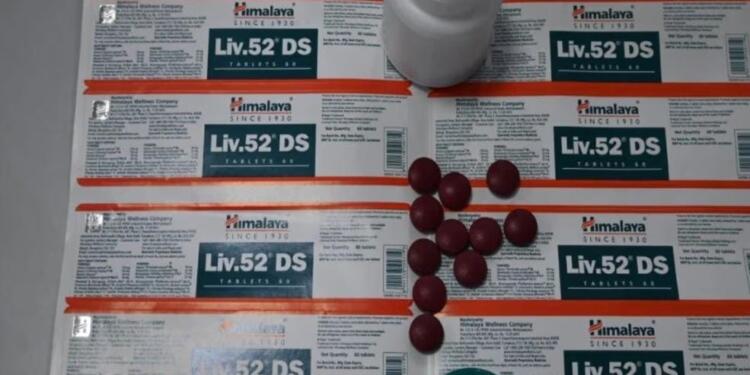 Himalaya Liv.52 DS tablets with original blister packs, bottle, and tablets for liver health support.